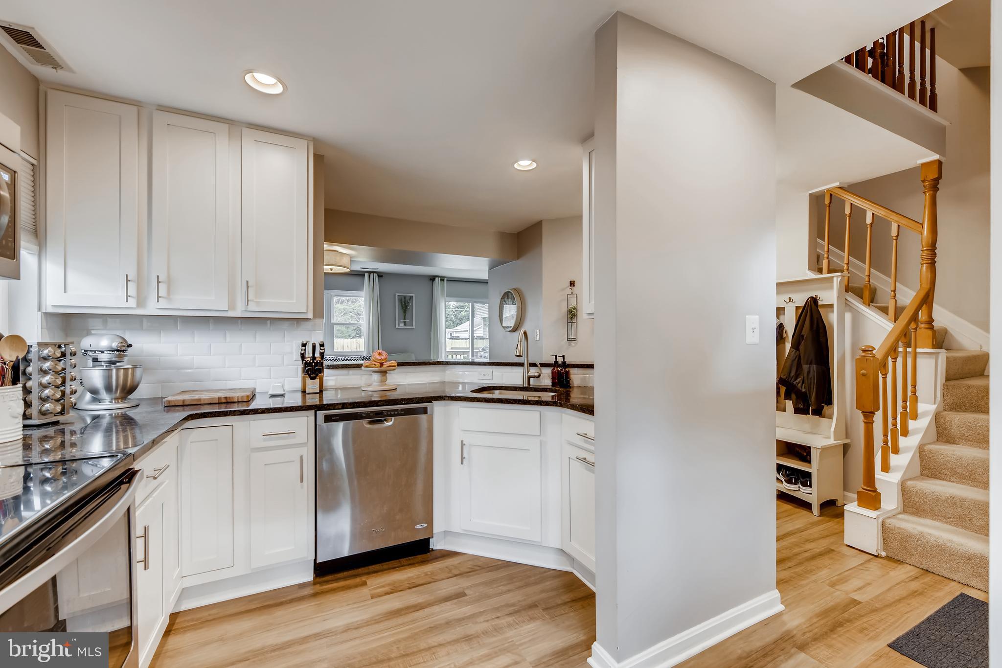 1625 Hilltop Road Edgewater, MD 21037 - Photo 10 of 38 a kitchen with stainless steel appliances granite countertop a sink and cabinets