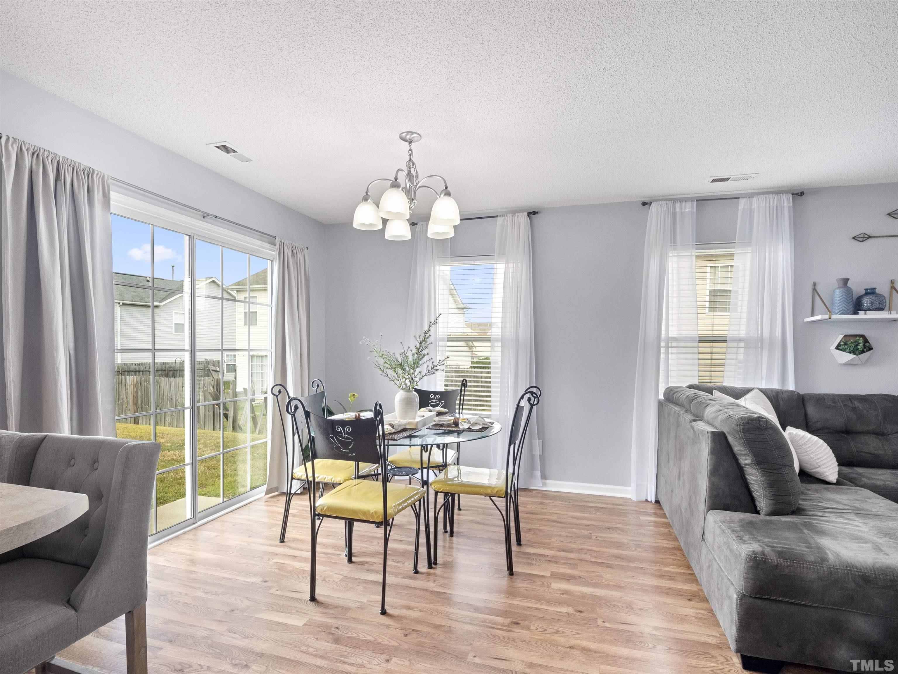 3737 Marshlane Way Raleigh, NC 27610 - Photo 6 of 26 a view of a dining room with furniture window and wooden floor