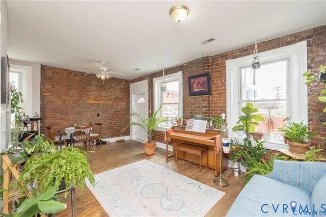 a kitchen with stainless steel appliances a refrigerator sink and white cabinets