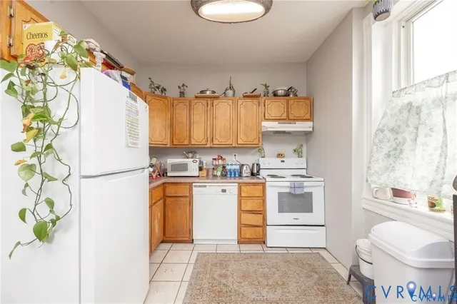 a bedroom with a bed and a table in it