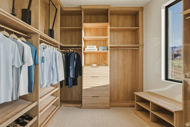 923 North Emery Lane Elk Ridge, UT 84651 - Photo 33 of 101 Custom wood-finish closet system featuring integrated shelving, multiple hanging rods, and built-in drawers