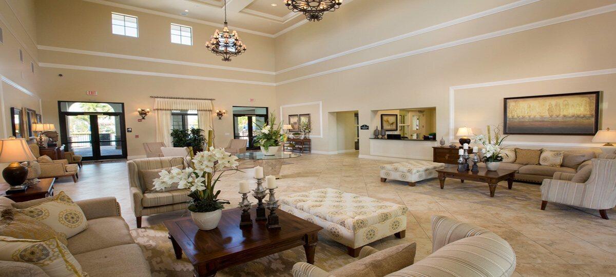 23765 Southwest 118 Avenue, Unit 23765 Homestead, FL 33032 - Photo 28 of 36 a living room with furniture and a flat screen tv