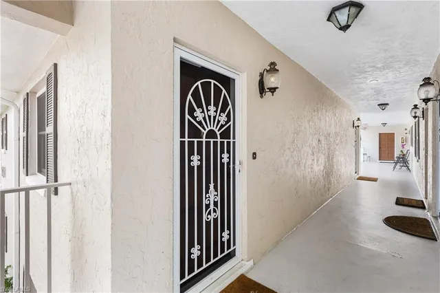 a view of a hallway with windows