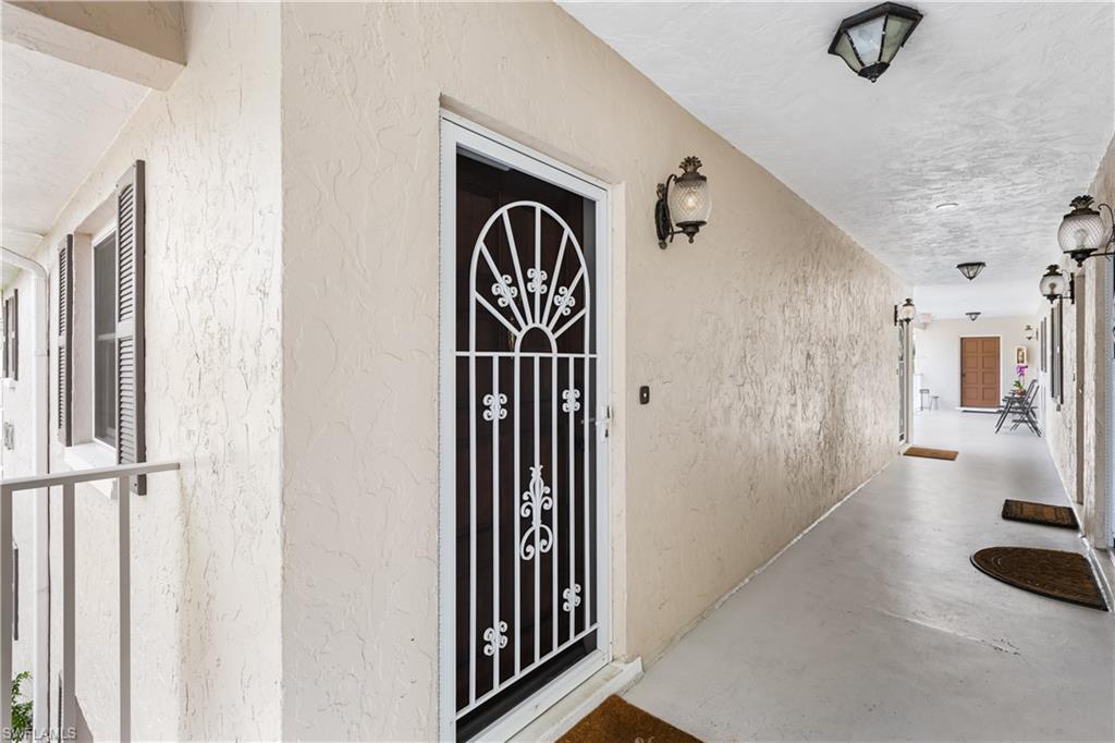 940 3rd Street South, Unit 201 Naples, FL 34102 - Photo 17 of 27 a view of a hallway with windows