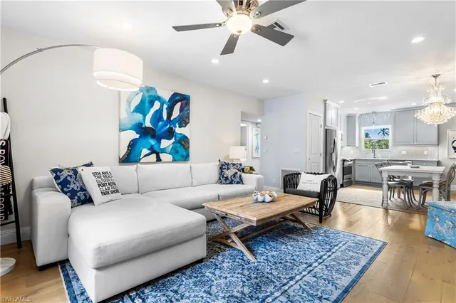 a living room with furniture and a rug