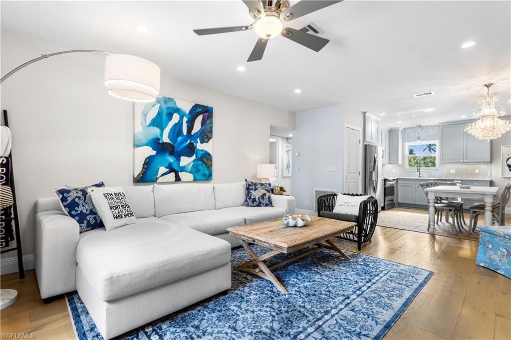 940 3rd Street South, Unit 201 Naples, FL 34102 - Photo 2 of 27 a living room with furniture and a rug