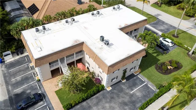a aerial view of a house with a yard