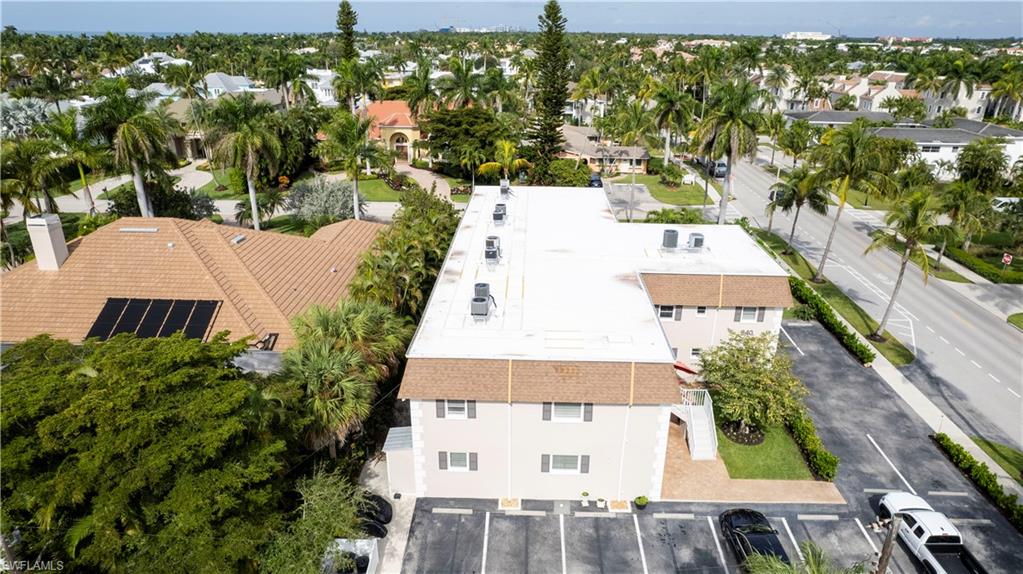 940 3rd Street South, Unit 201 Naples, FL 34102 - Photo 24 of 27 an aerial view of a house with a yard