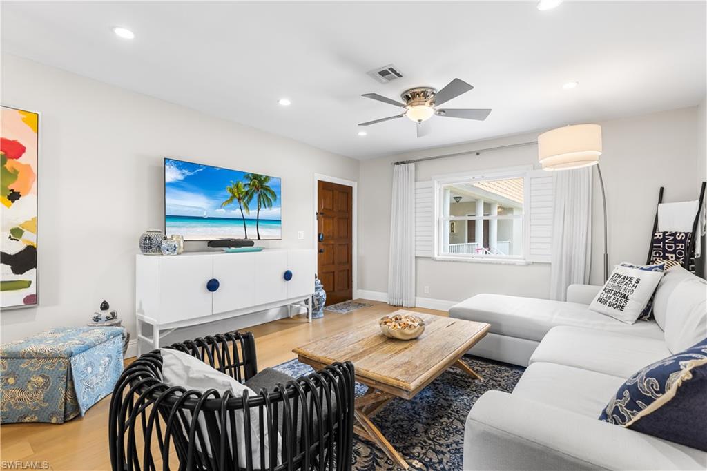 940 3rd Street South, Unit 201 Naples, FL 34102 - Photo 4 of 27 a living room with furniture and a flat screen tv