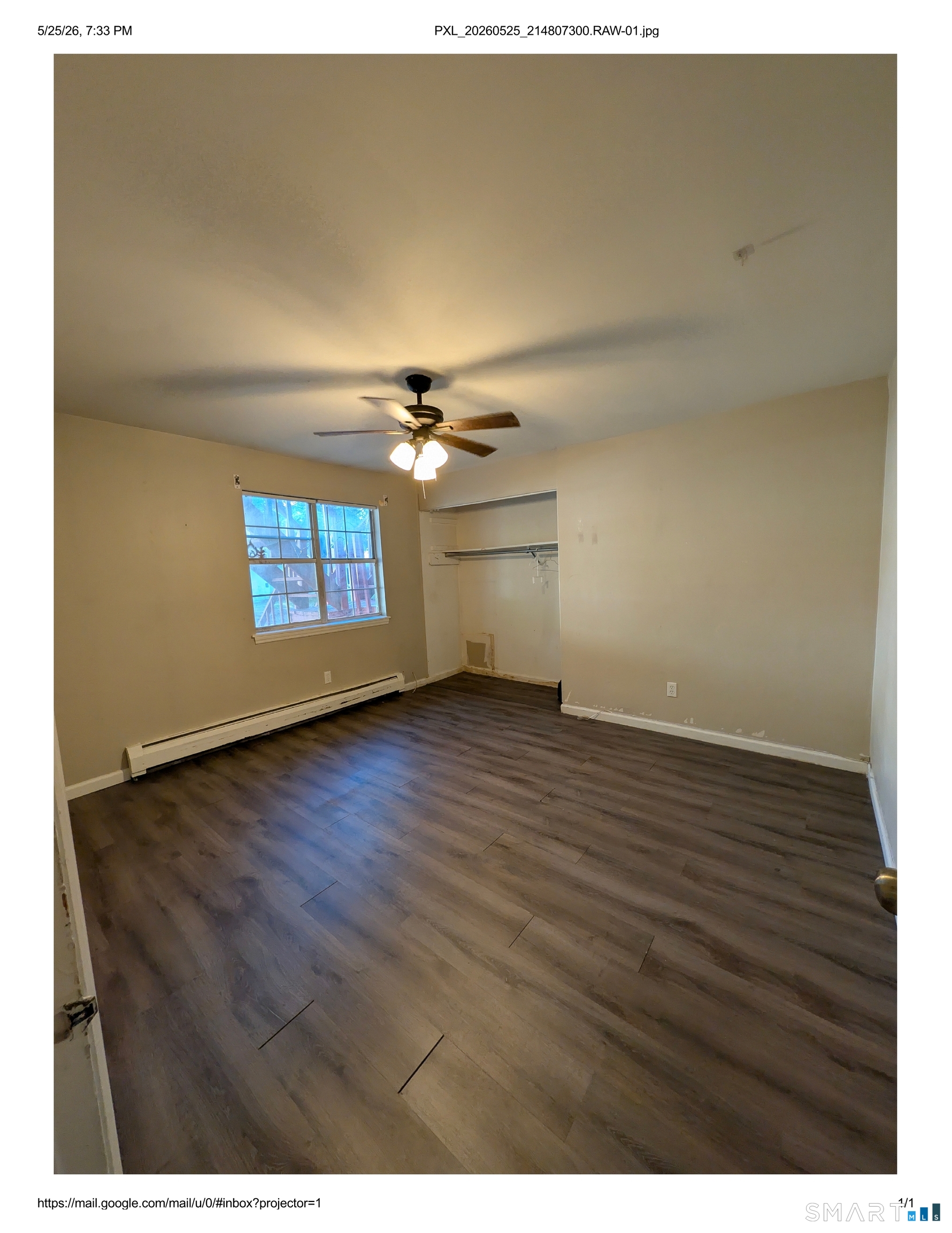 62 Angel Drive, Unit A Waterbury, CT 06708 - Photo 6 of 11 a view of an empty room with wooden floor and a window