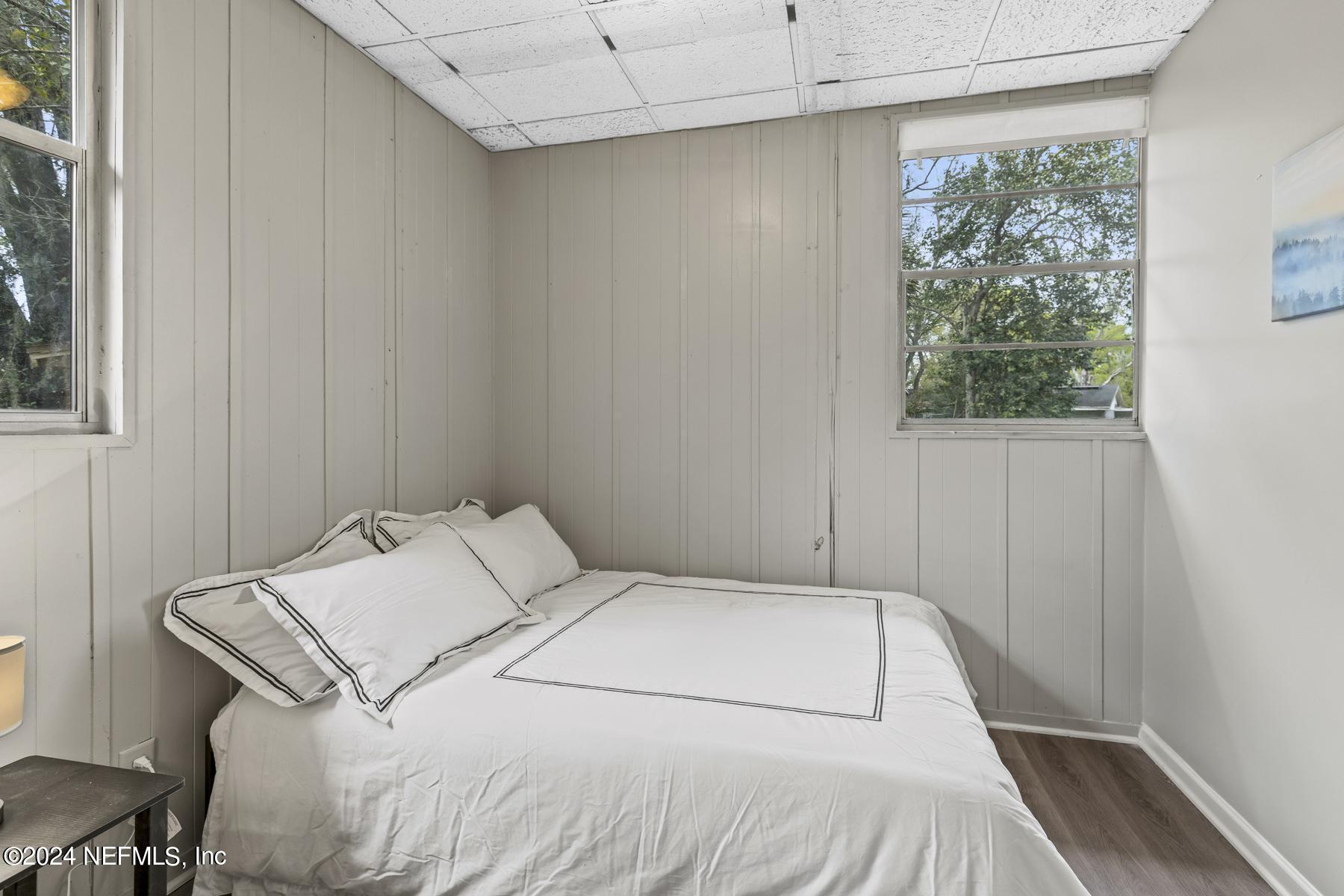 7142 Richardson Road Jacksonville, FL 32209 - Photo 6 of 10 a bedroom with a bed and a window