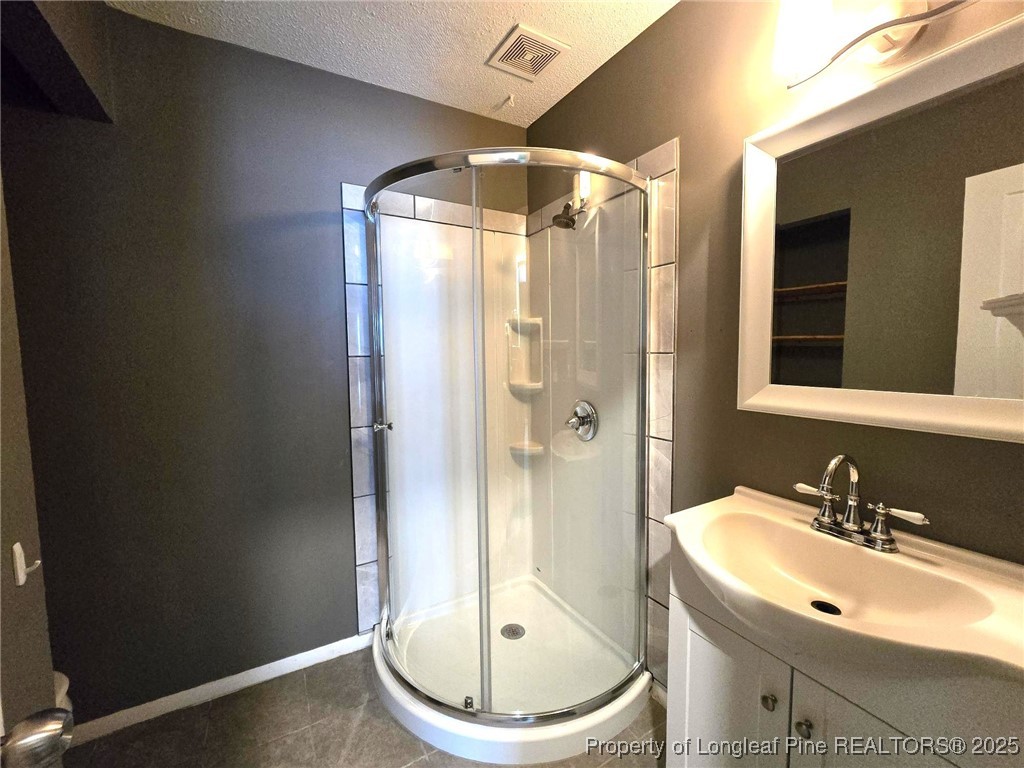 1540 Graystone Road Fayetteville, NC 28311 - Photo 13 of 19 a bathroom with a sink and a mirror