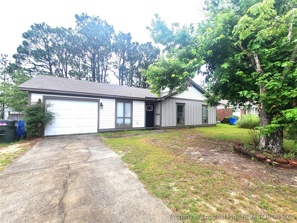 1540 Graystone Road Fayetteville, NC 28311 - Photo 2 of 19 a view of a house with a yard and large tree