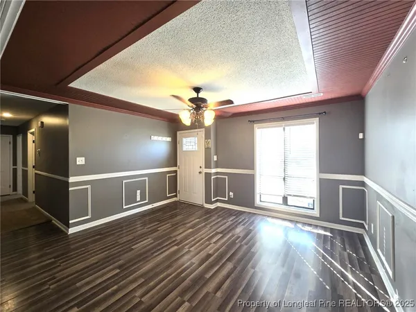 a view of a livingroom with wooden floor