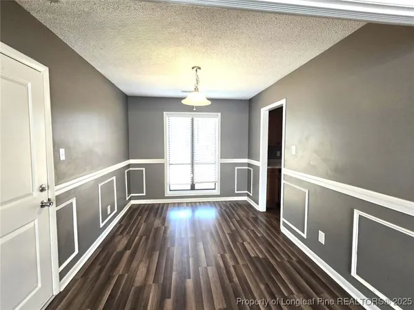 a view of gallery with wooden floor
