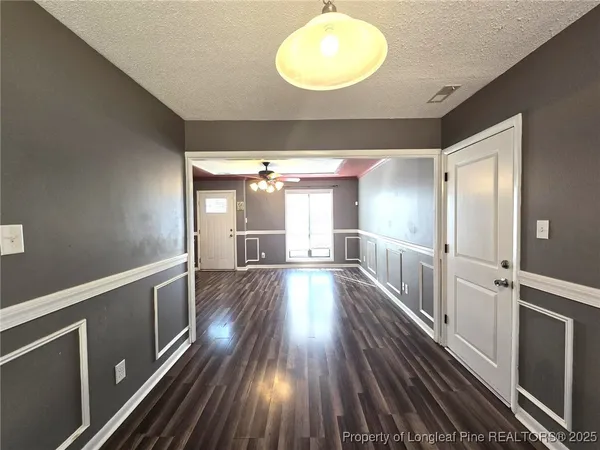 a kitchen with refrigerator a sink and a microwave