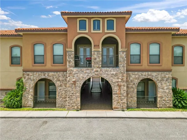 a front view of a house with yellow lighting