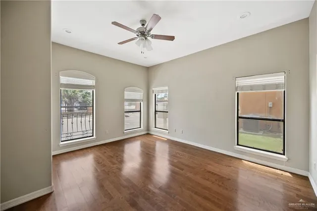 a bathroom with a granite countertop tub sink and mirror