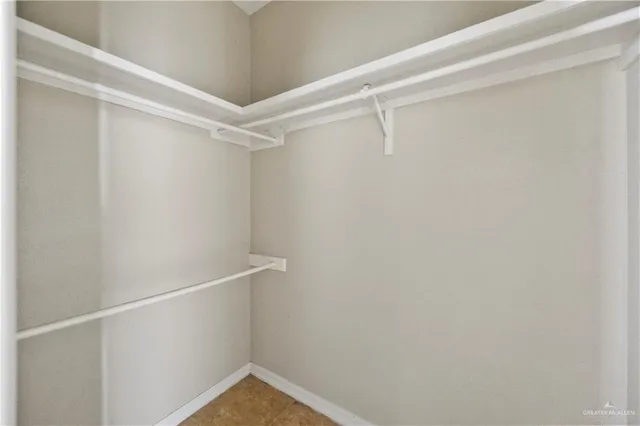 a bedroom with a bed and a painting