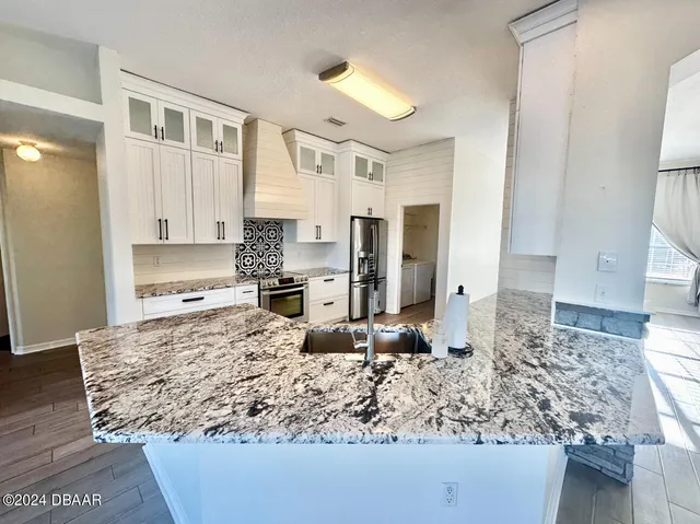 a kitchen with kitchen island granite countertop a granite counter tops and a counter space