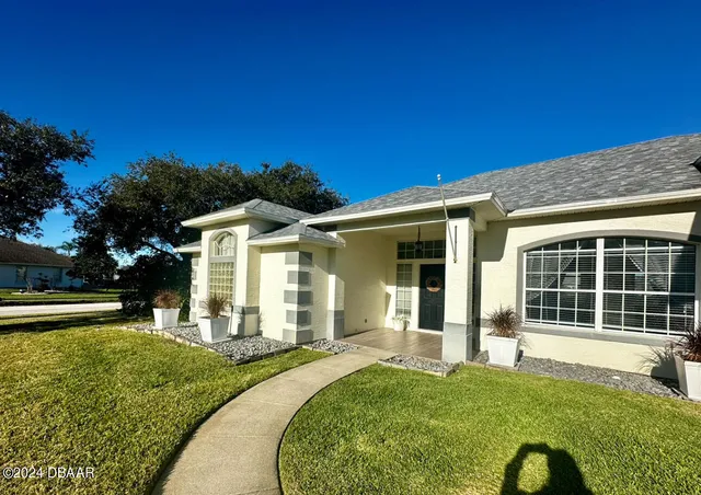 front view of a house with a yard