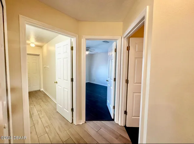a view of a bathroom from a hallway