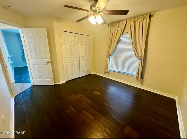 a view of an entryway with wooden floor
