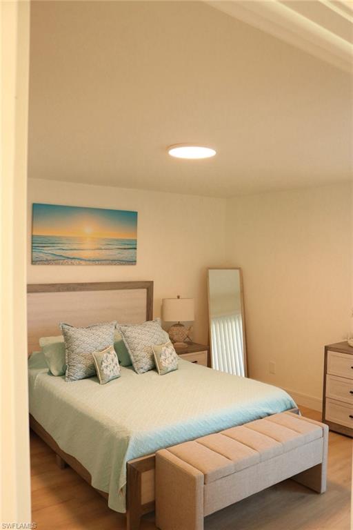 2235 San Marco Road, Unit 5204 Marco Island, FL 34145 - Photo 4 of 34 Recessed ceiling light fixture illuminating a room with light wood-finish flooring