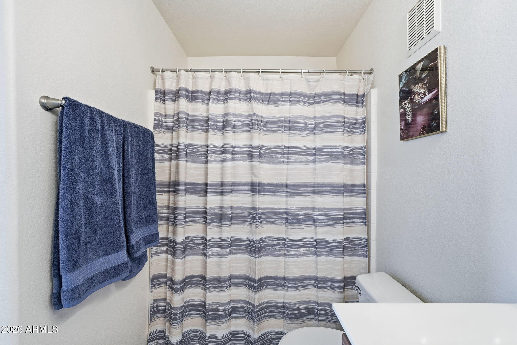 280 South Evergreen Road, Unit 1320 Tempe, AZ 85288 - Photo 11 of 14 a bathroom with a bathtub and shower