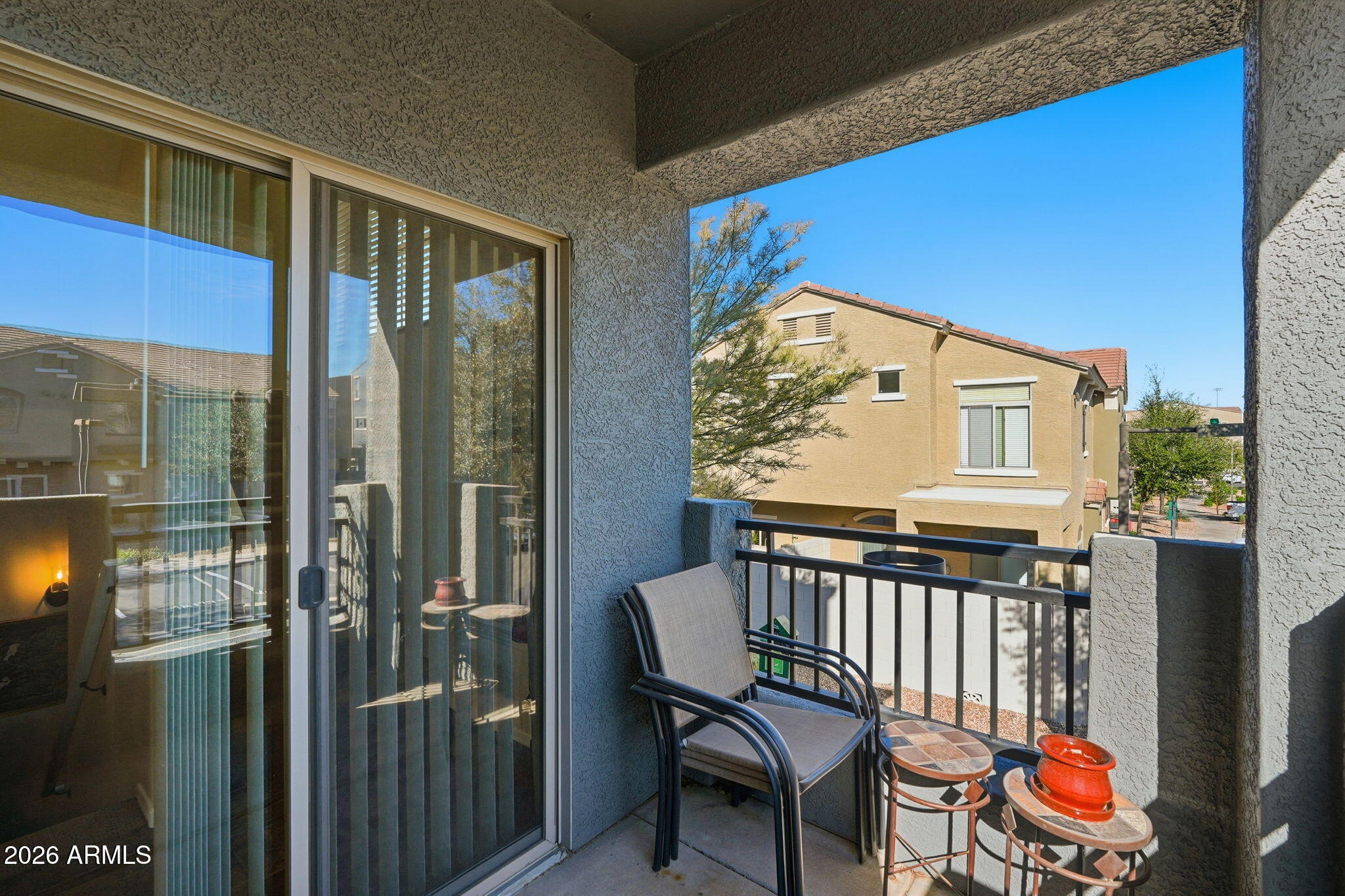 280 South Evergreen Road, Unit 1320 Tempe, AZ 85288 - Photo 14 of 14 a view of a chairs and table in a balcony