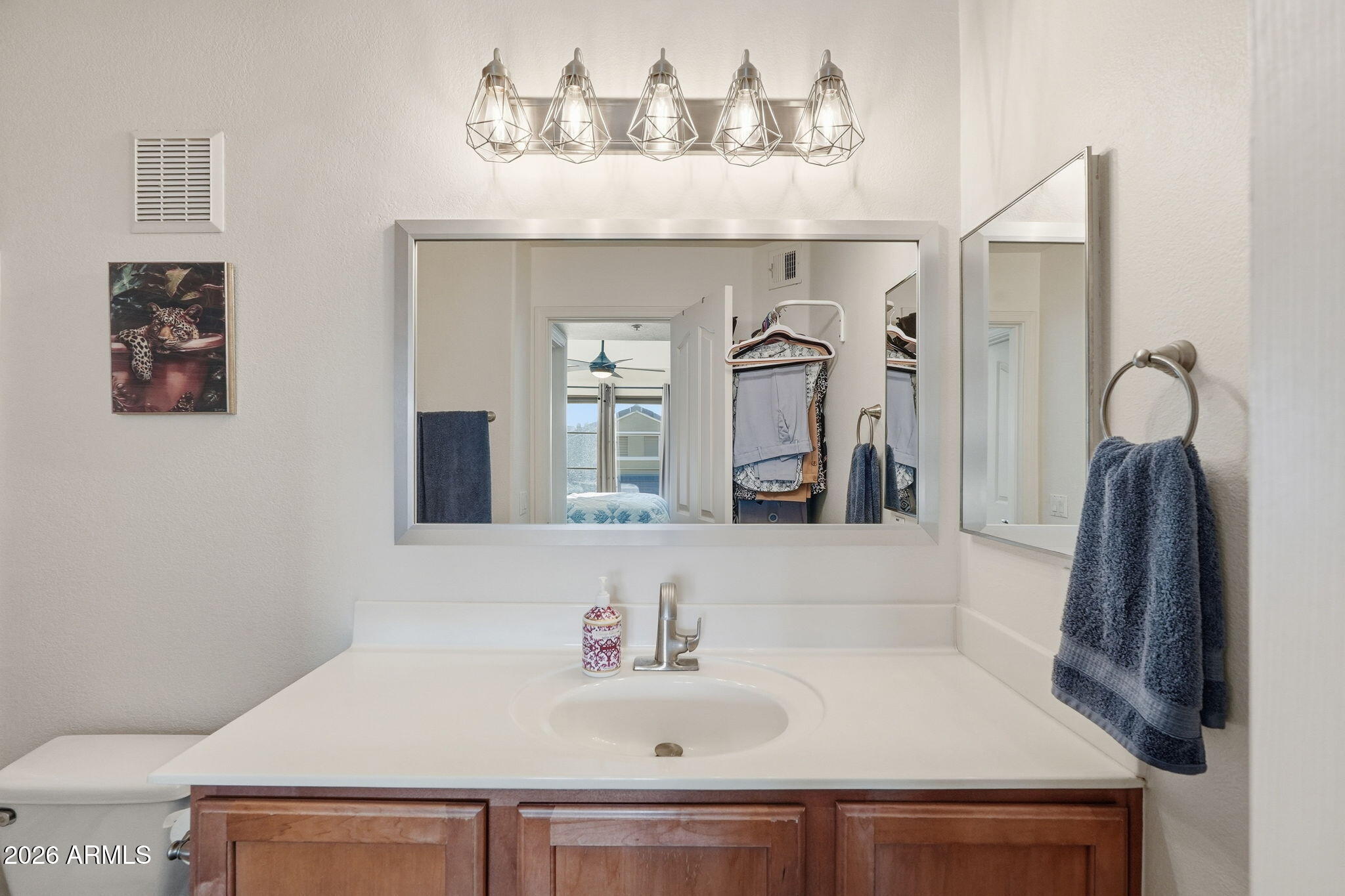 280 South Evergreen Road, Unit 1320 Tempe, AZ 85288 - Photo 10 of 14 a bathroom with a sink and a mirror