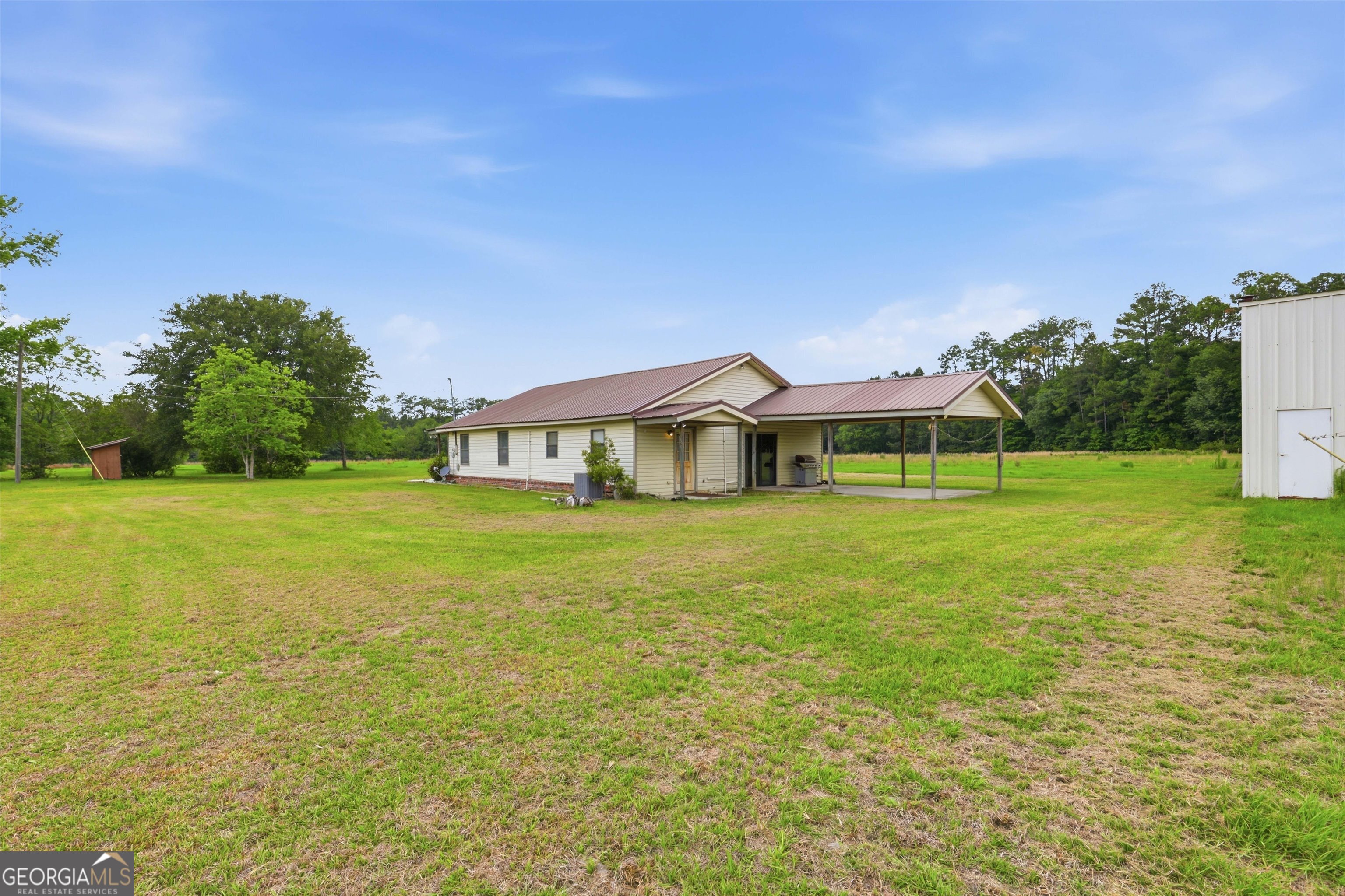 1525 Myron Hart Road Coolidge, GA 31738 - Photo 33 of 58 a view of a house with a big yard