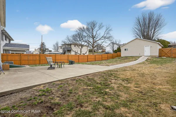 a backyard of a house with seating space