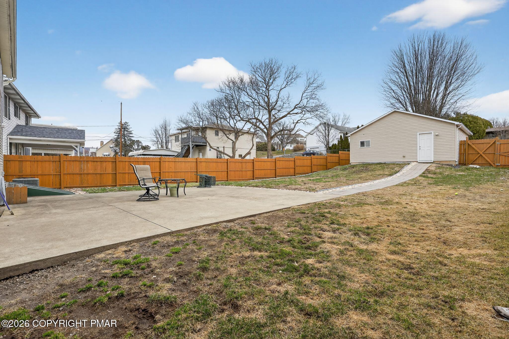 411 Moosic Road Old Forge, PA 18518 - Photo 14 of 59 a view of a yard with a slide
