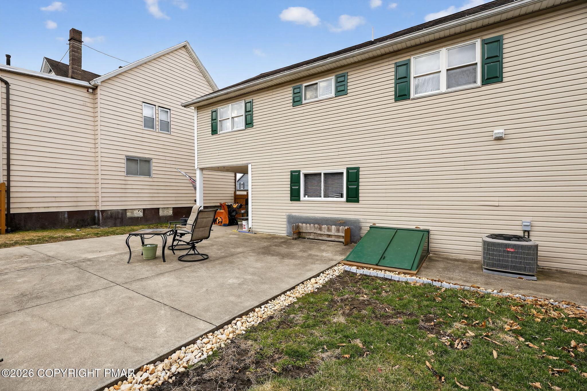411 Moosic Road Old Forge, PA 18518 - Photo 15 of 59 a backyard of a house with seating space