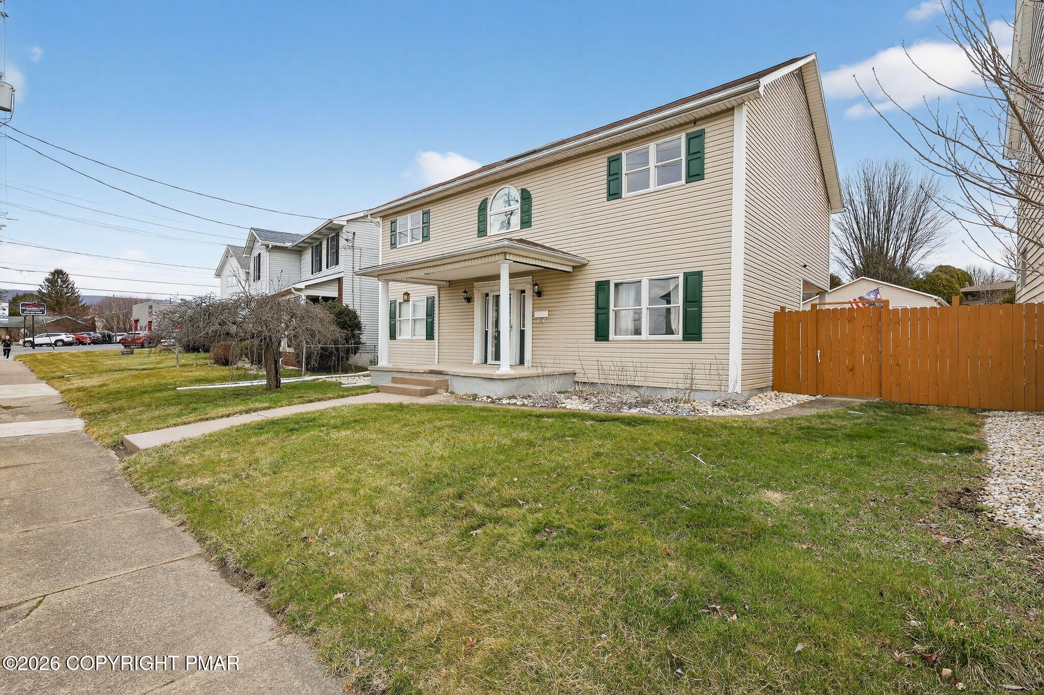 411 Moosic Road Old Forge, PA 18518 - Photo 2 of 59 a front view of house with yard and green space