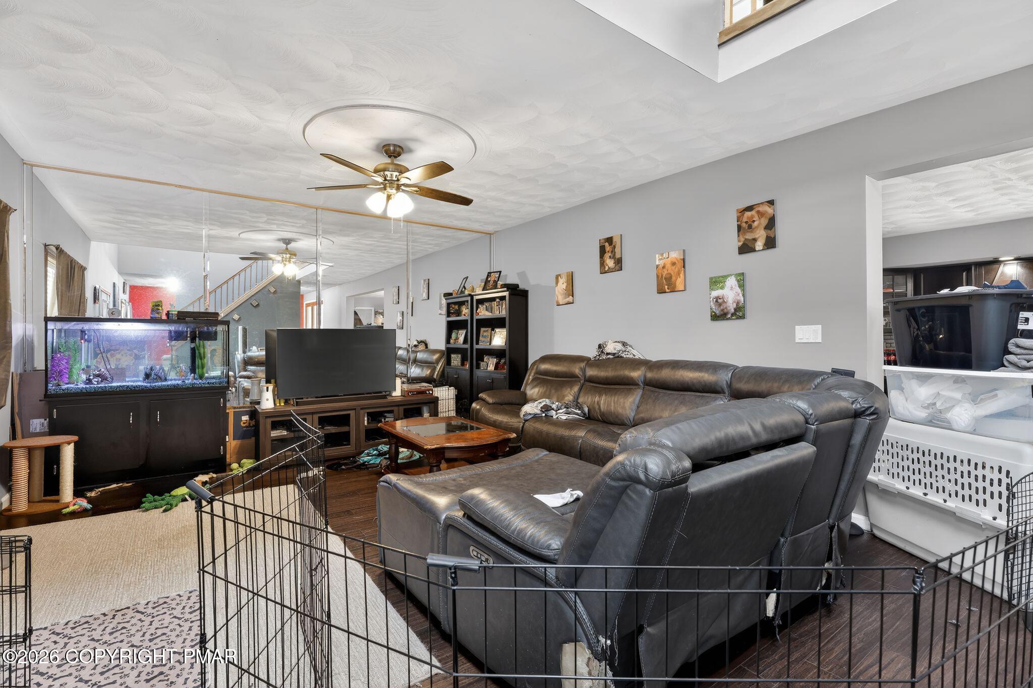 411 Moosic Road Old Forge, PA 18518 - Photo 30 of 59 a living room with furniture a flat screen tv and a table