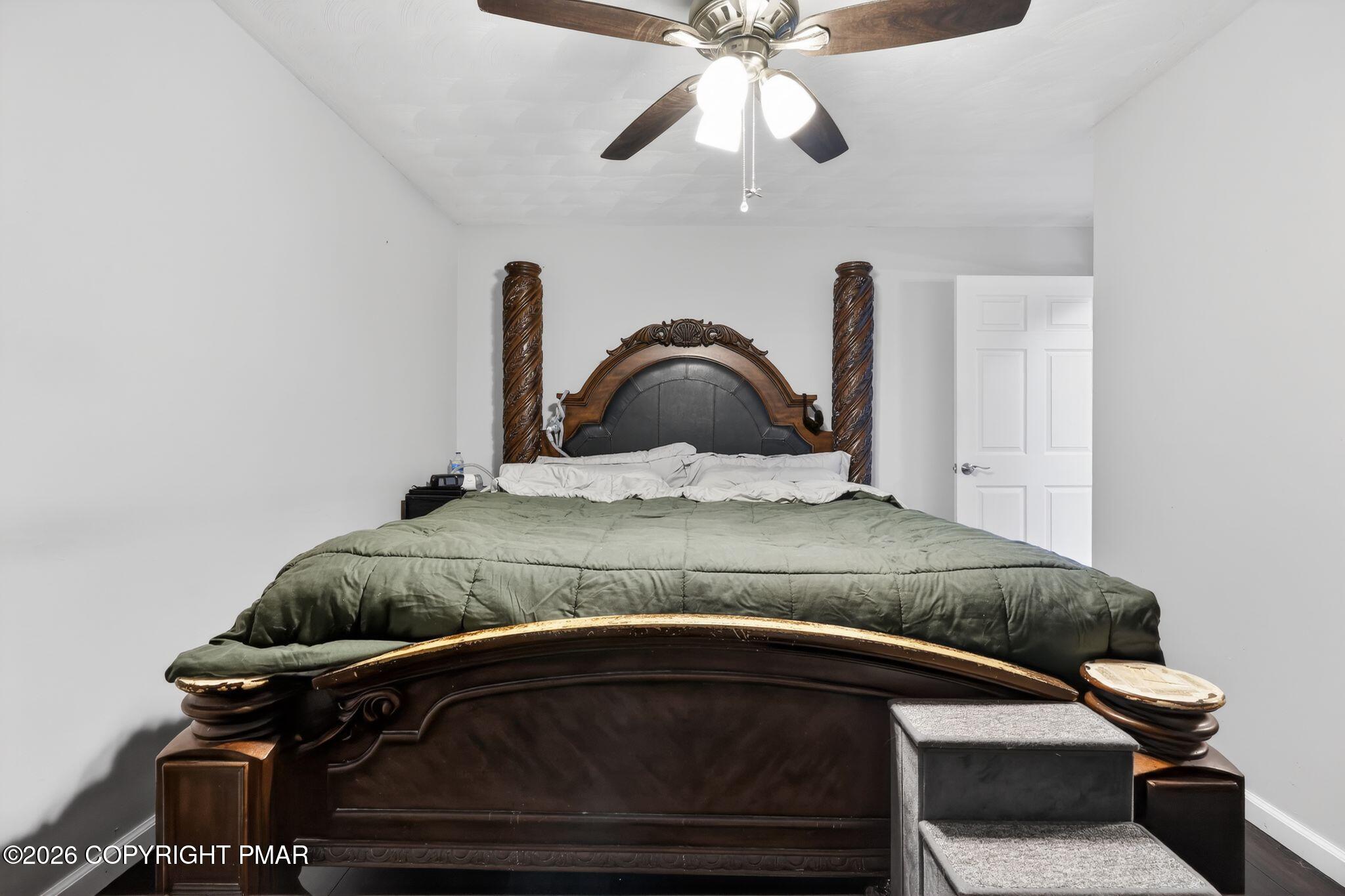 411 Moosic Road Old Forge, PA 18518 - Photo 35 of 59 a bedroom with a bed and a ceiling fan