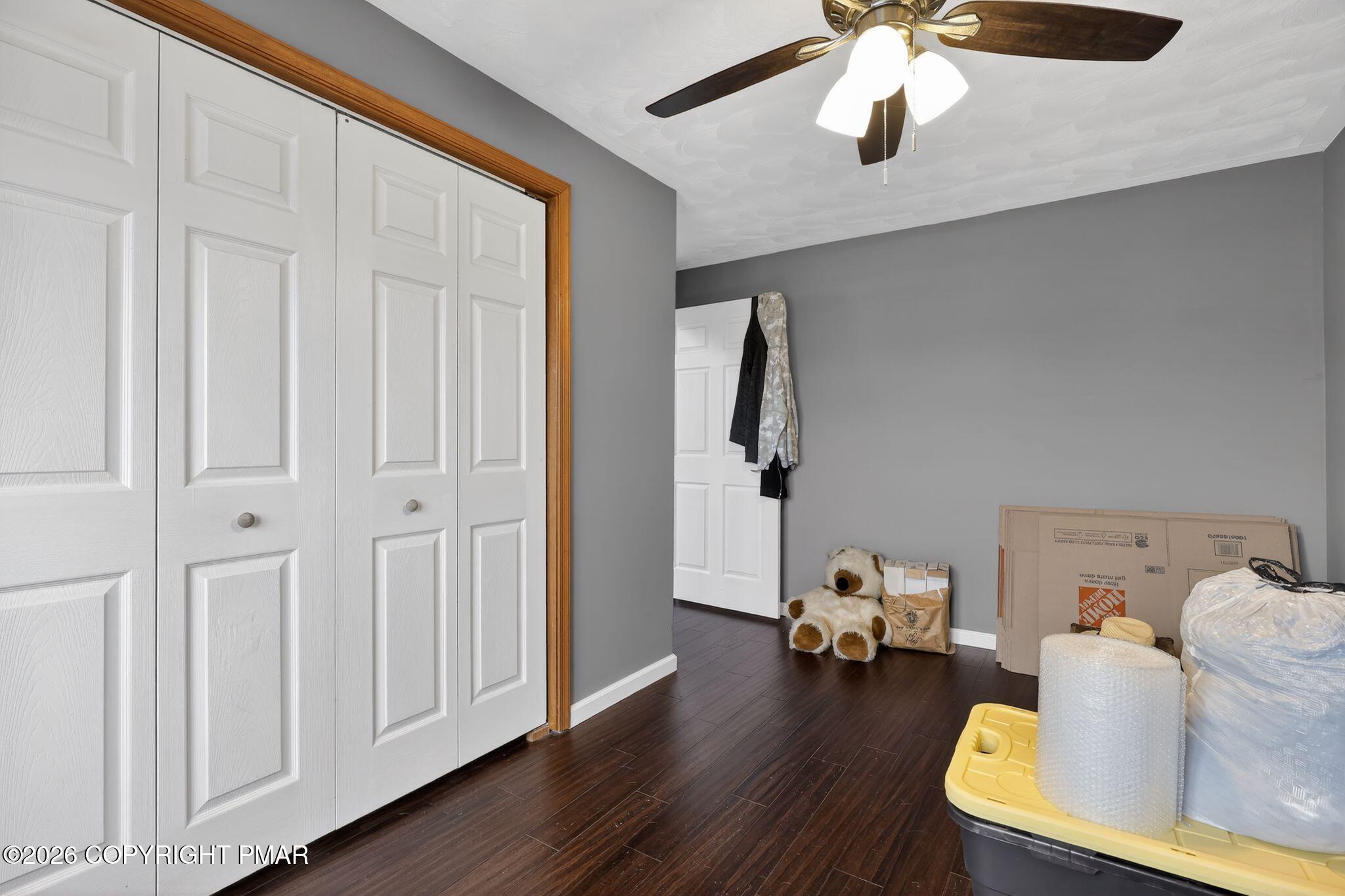 411 Moosic Road Old Forge, PA 18518 - Photo 37 of 59 a living room with furniture and a wooden floor