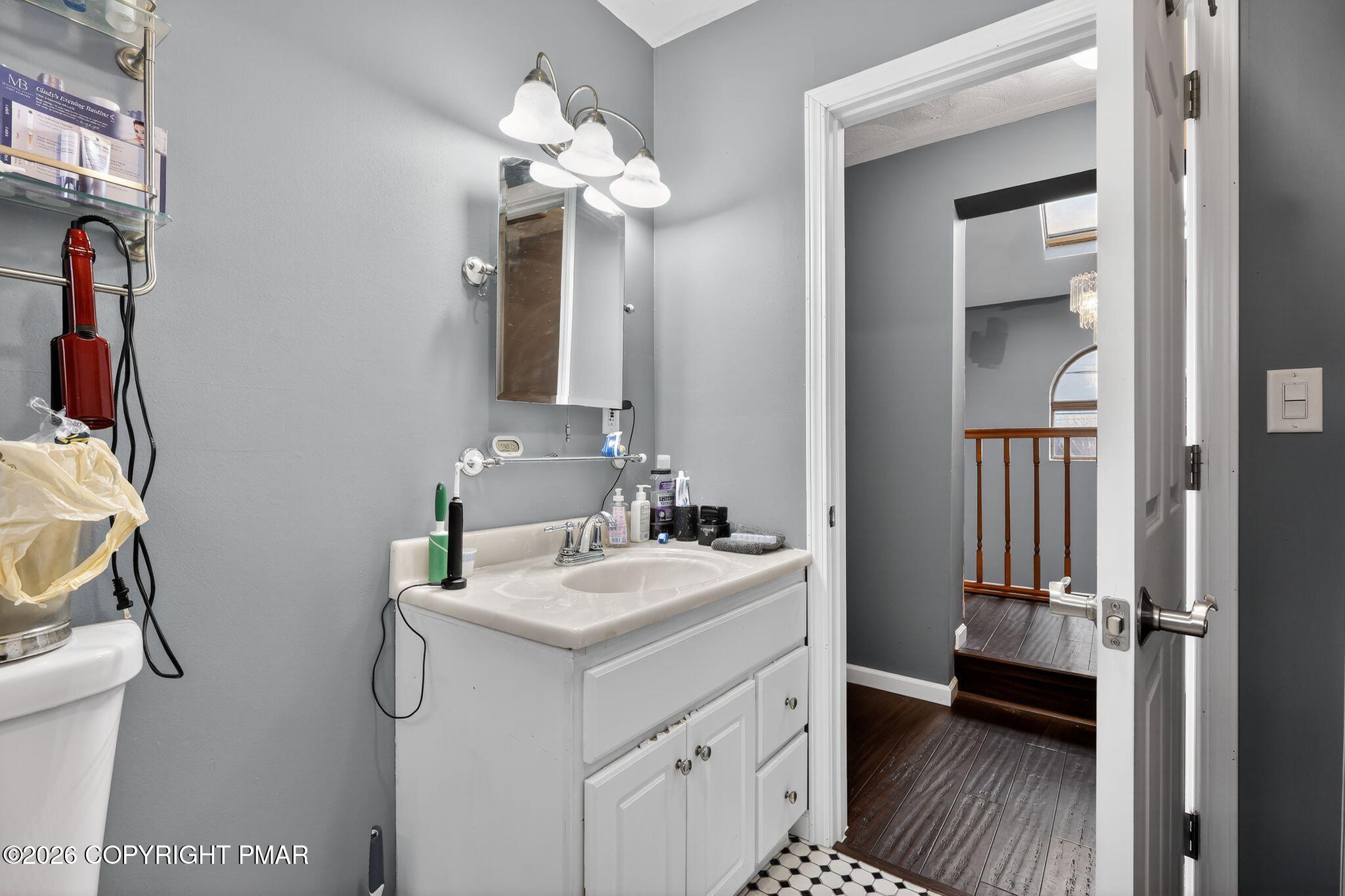 411 Moosic Road Old Forge, PA 18518 - Photo 41 of 59 a bathroom with a sink and a mirror
