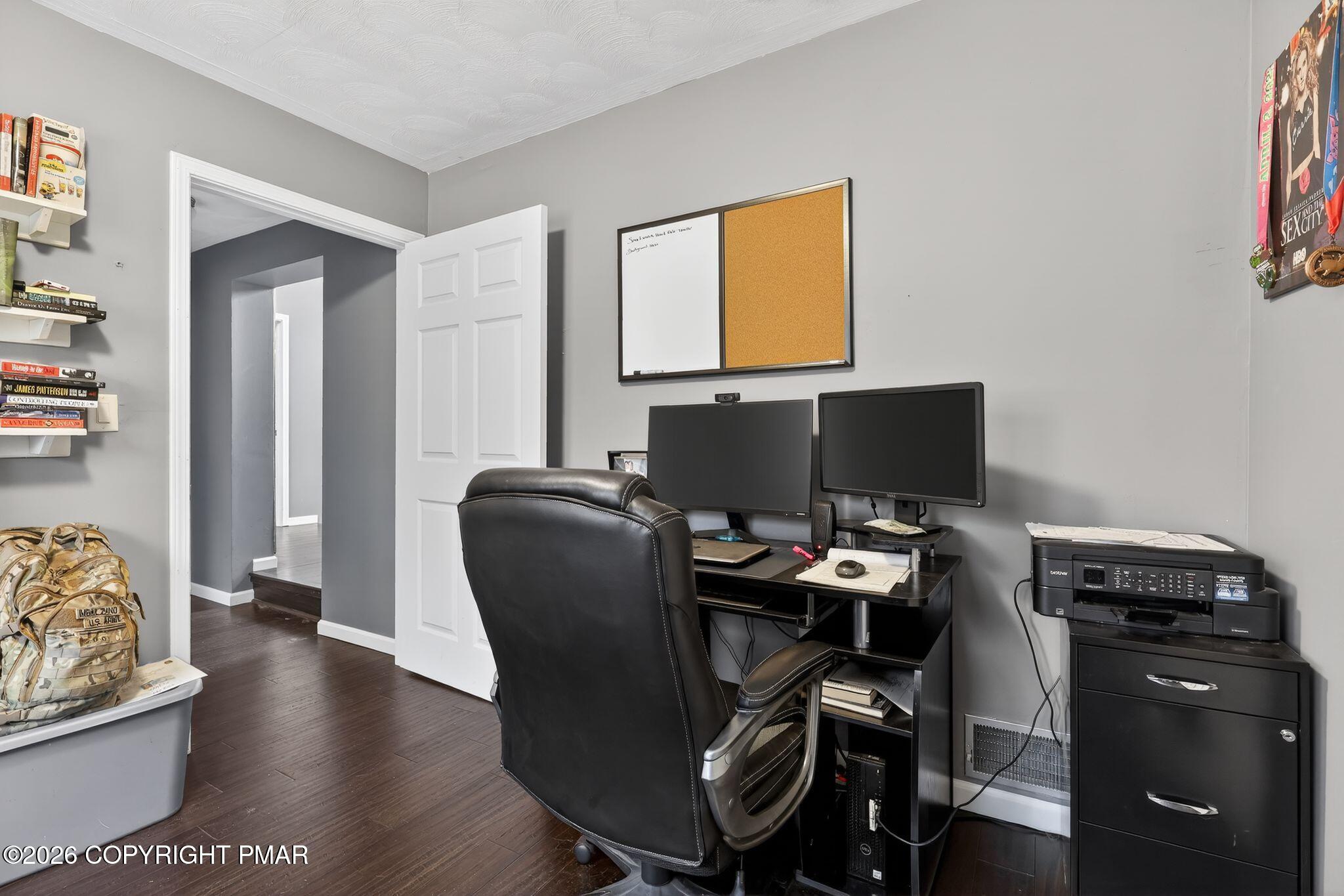 411 Moosic Road Old Forge, PA 18518 - Photo 43 of 59 a view of a workspace with furniture and wooden floor