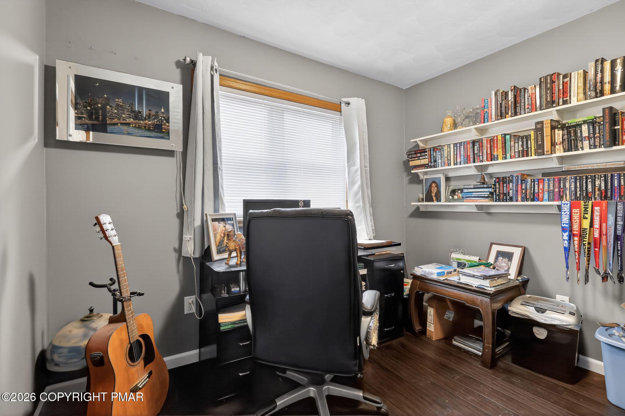 411 Moosic Road Old Forge, PA 18518 - Photo 46 of 59 a room with furniture and a bookshelf