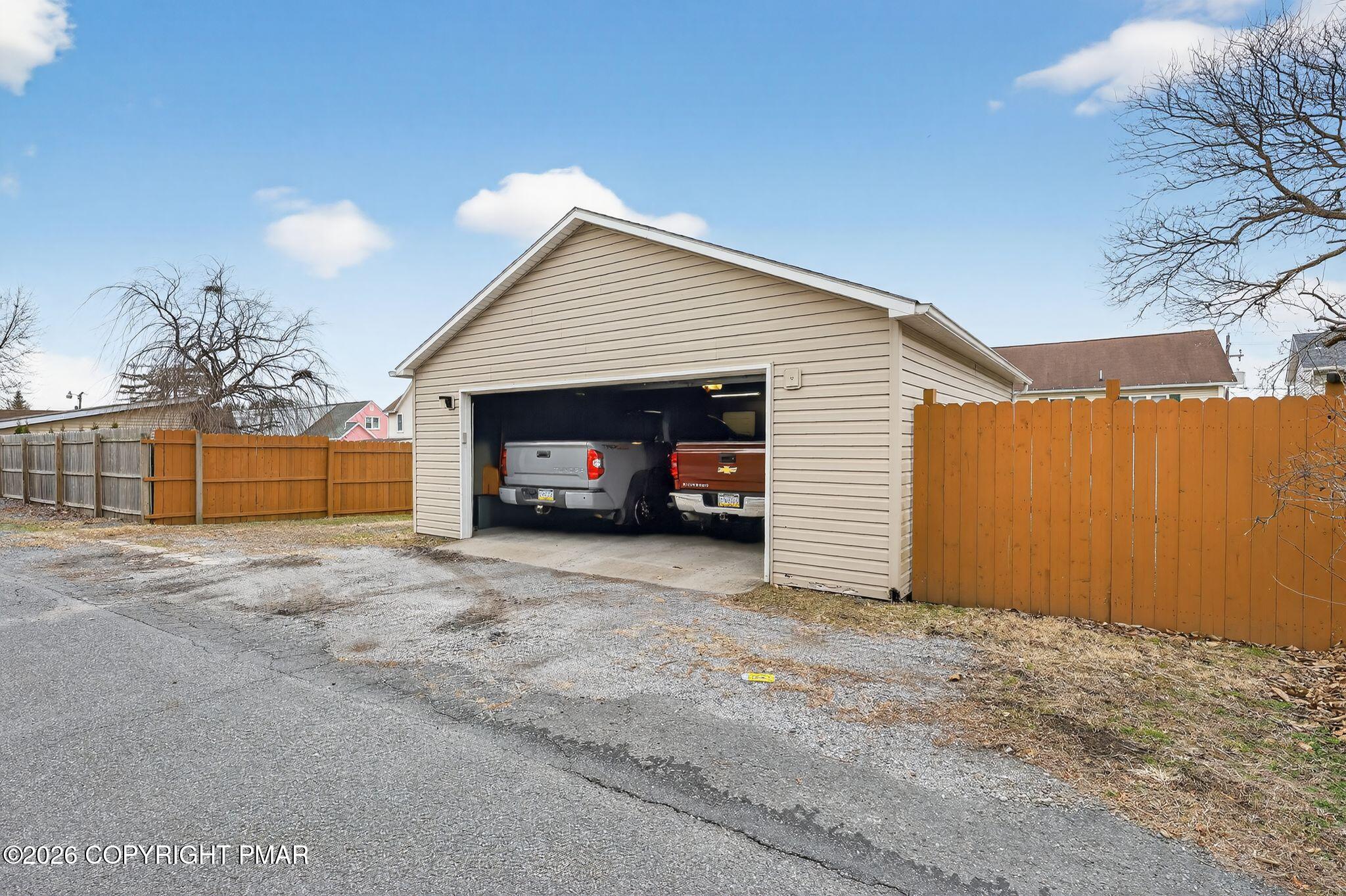 411 Moosic Road Old Forge, PA 18518 - Photo 6 of 59 a view of a house with a yard and garage
