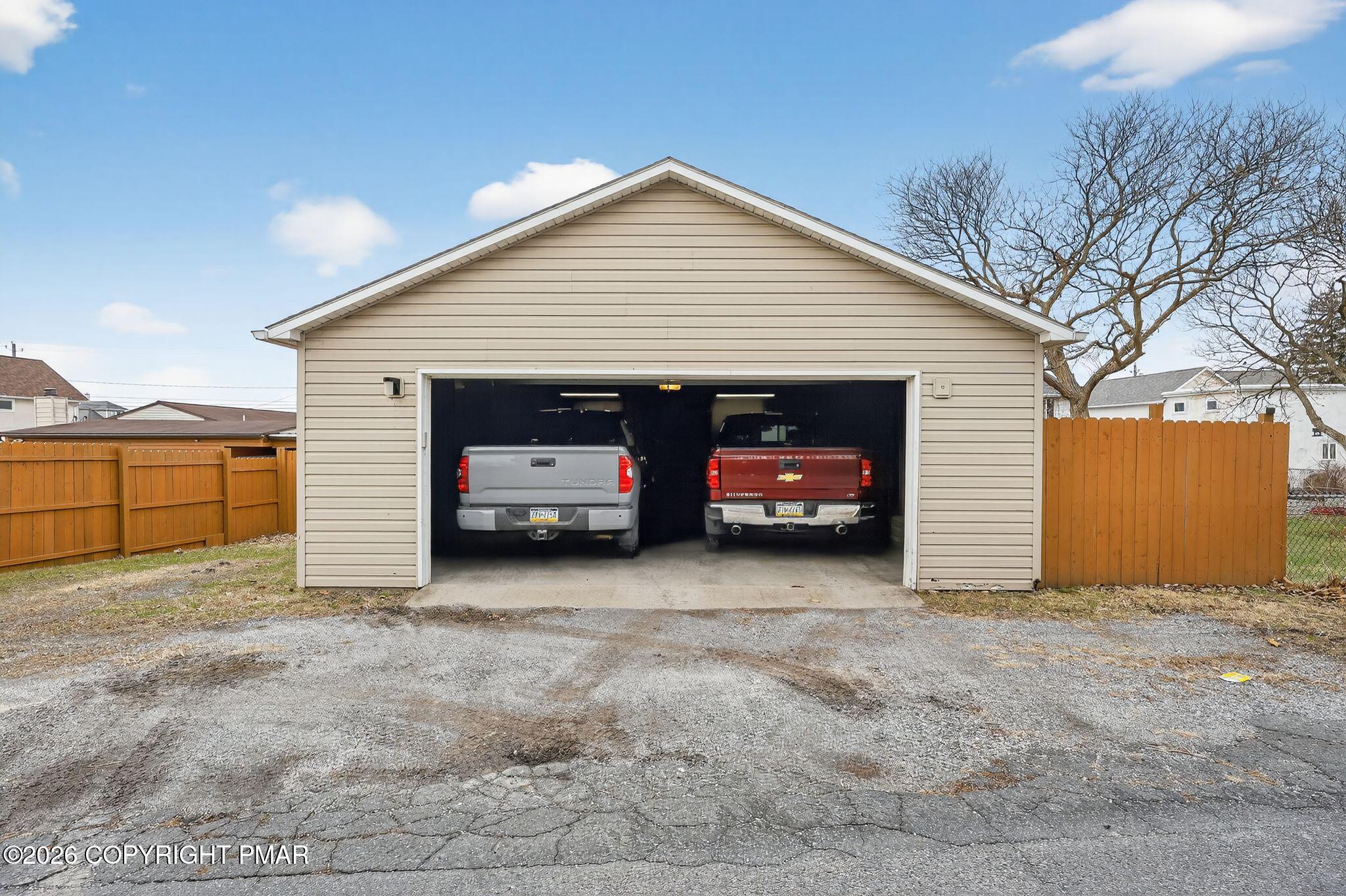 411 Moosic Road Old Forge, PA 18518 - Photo 8 of 59 a view of a house with a yard and garage