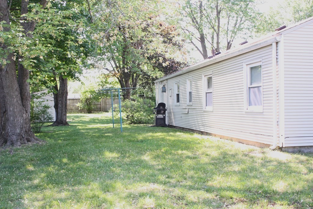 25 Kirk Drive Springfield, MA 01109 - Photo 4 of 14 a view of a backyard with a large tree