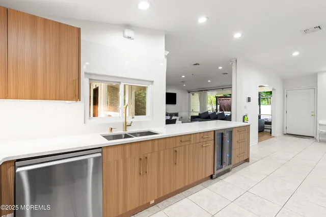 a kitchen with a sink and cabinets