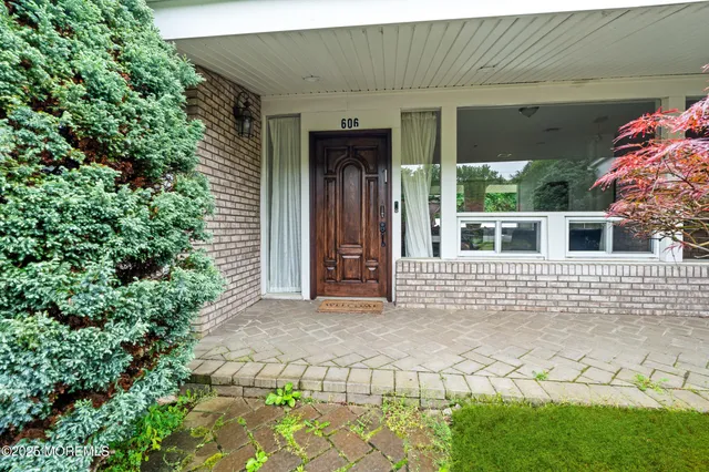 a front view of a house with a garage