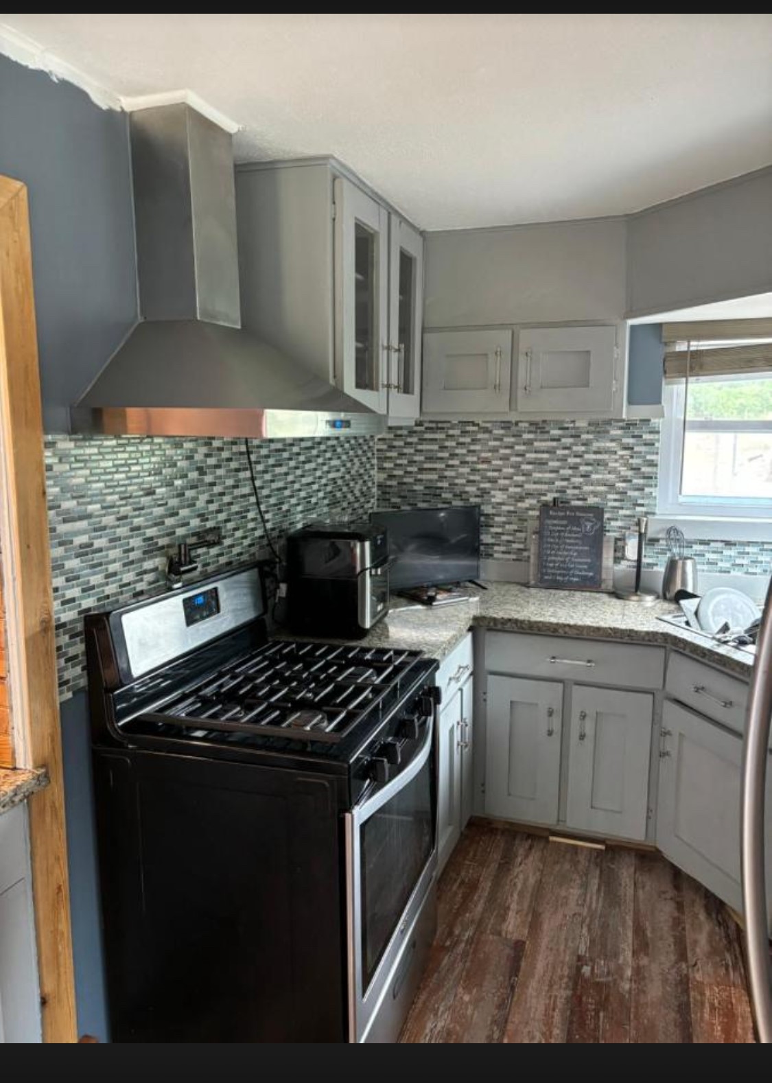 6811 St Augustine Street Houston, TX 77021 - Photo 4 of 20 a kitchen with granite countertop a stove and a sink