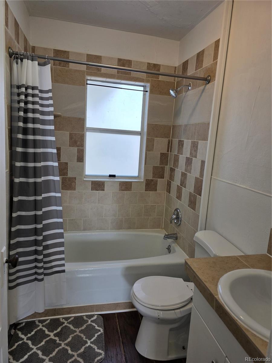 314 7th Street Ovid, CO 80744 - Photo 11 of 17 a bathroom with a sink a toilet and shower