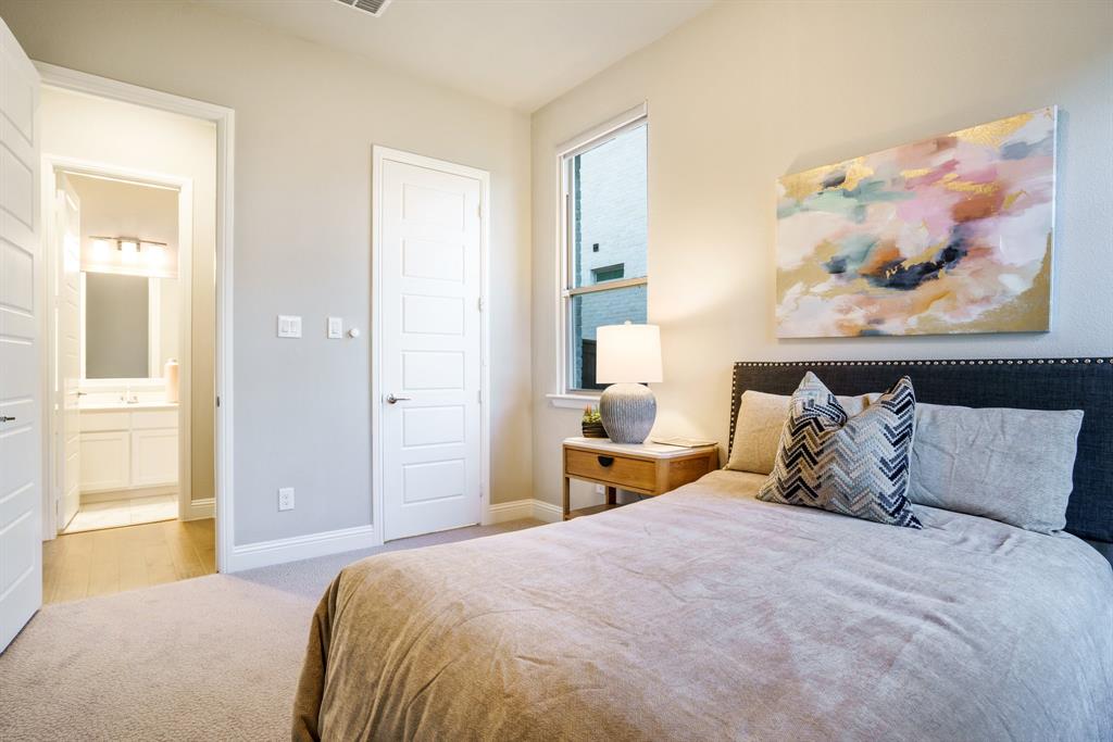 892 Panorama Drive Allen, TX 75013 - Photo 12 of 40 a bedroom with bed and cupboard